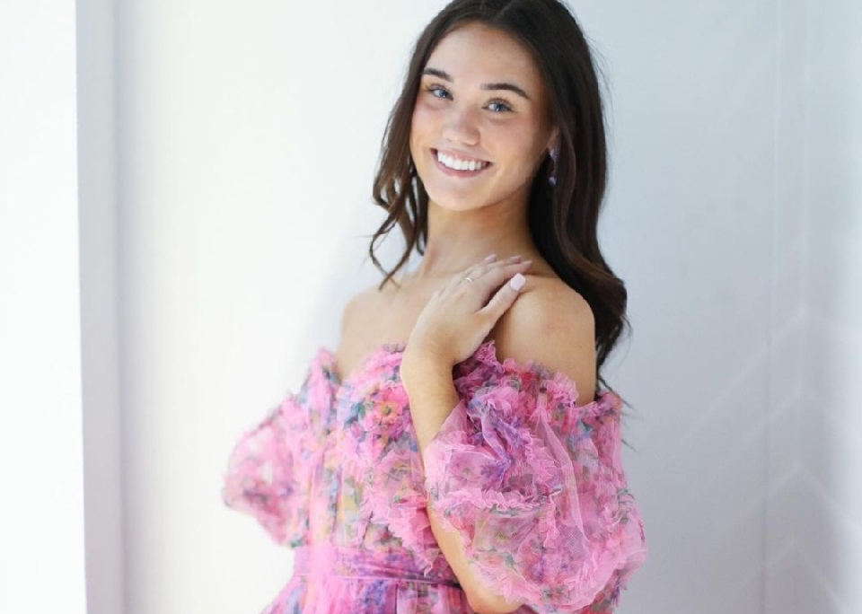 Model wearing pink homecoming dress